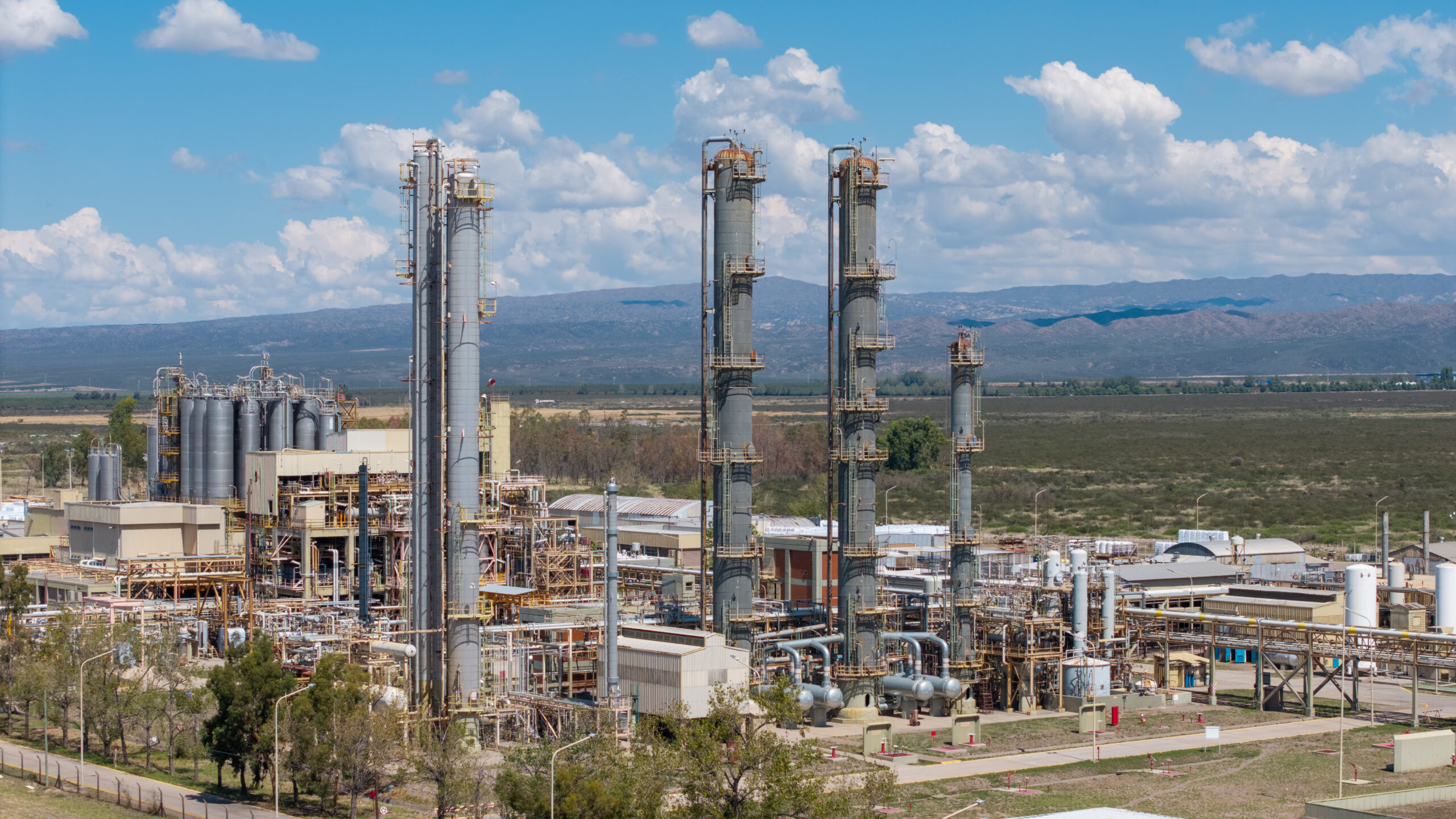 Petrochemical refinery towers under blue sky