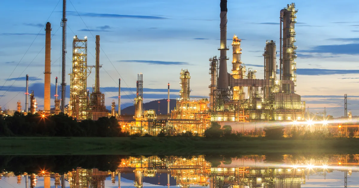 An oil & gas refinery at sunset
